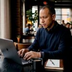 Man working on iCloud locked MacBook Pro